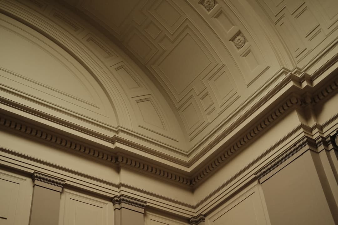 Ceiling with detailed molding and trim in polished finish