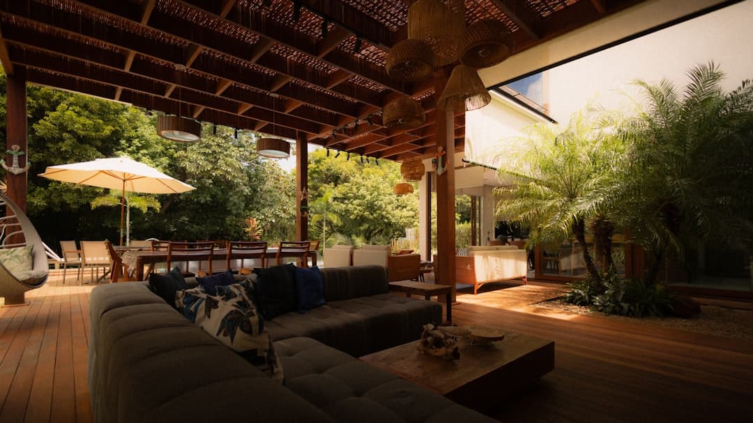 Luxurious outdoor living space with stained deck and modern furnishings