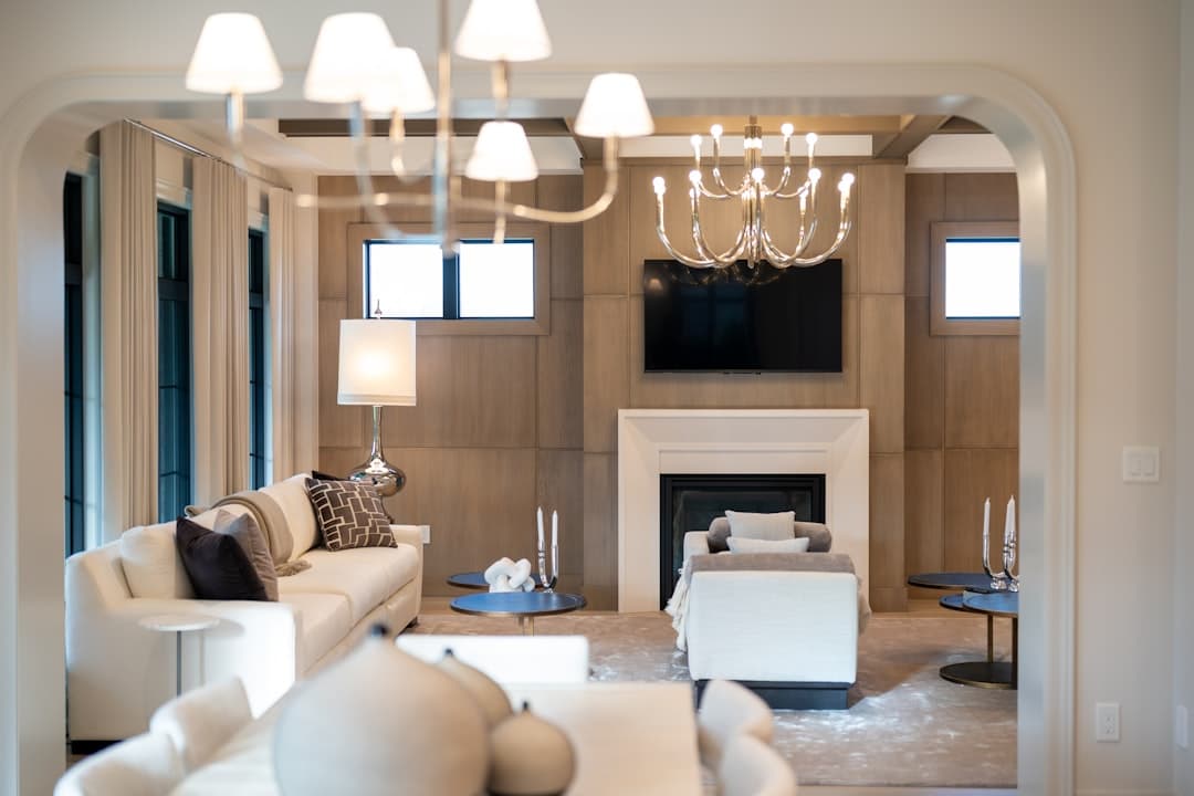 Elegant living room with fireplace and modern furniture showcasing freshly painted walls